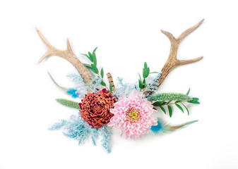 Antlers decorated with flowers isolated on white background