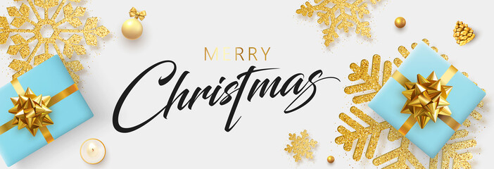 Merry Christmas banner with blue top view gifts and golden snowflakes.