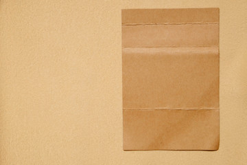 fold brown paper on brown fabric texture