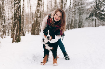Naklejka na ściany i meble girl with dog in winter forest