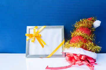 Christmas background with red hat, gifts, tree decoration