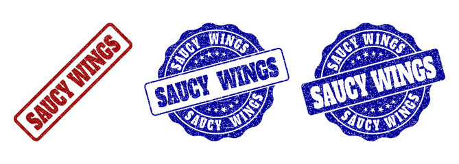 SAUCY WINGS grunge stamp seals in red and blue colors. Vector SAUCY WINGS signs with grunge effect. Graphic elements are rounded rectangles, rosettes, circles and text tags.