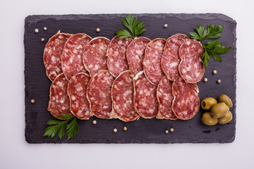 Saucisson sec delicious french salami on a white background