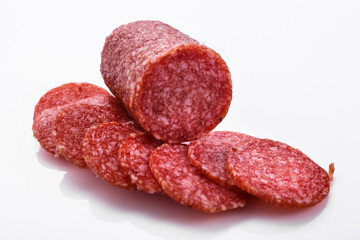delicious sliced salami on a white background
