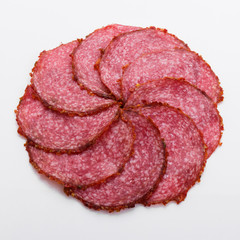 delicious sliced salami on a white background