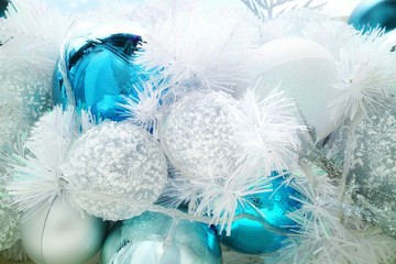 Christmas fir tree with decoration, white and blue ball with lighting. Soft focus. White christmas background concept.