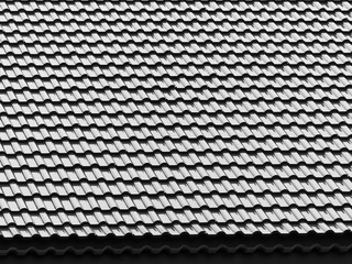 black and white tile roof with light and shadow pattern