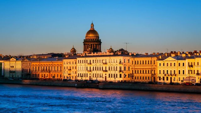 St Petersburg, Russia. Moyka river in Saint Petersburg, Russia in the evening, historical buildings, bridges and clear sunset sky. Various bars and restaurants. Time-lapse at sunset