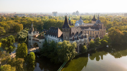 Fototapeta premium Vajdahunyad castle view from lakeside. Budapest, Hungary Filmed from the drone