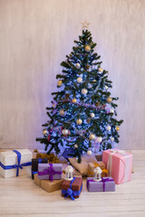 Fototapeta na wymiar Christmas tree with presents new year holiday Garland lights