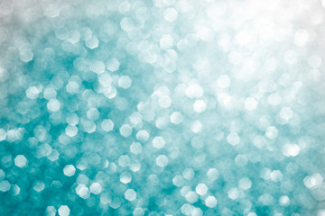festive blue turquoise glitter background bokeh with space for text