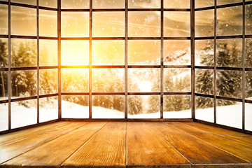 Winter window of wood and landscape of mountains and sunset time 