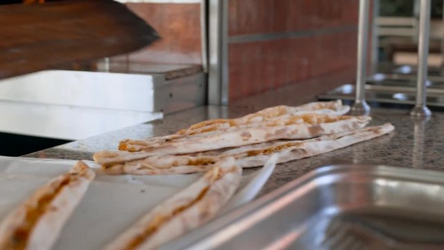 A man prepares delicious traditional Turkish cakes Pida. 4k