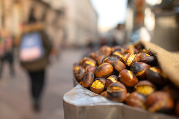 Roasted chestnuts for sale on the street in the city in the fall