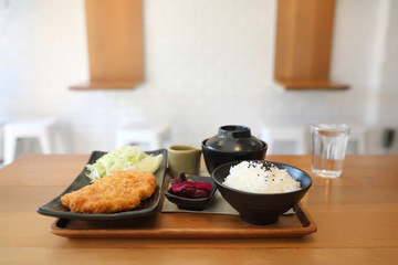 Tonkatsu fried pork cutlet with rice and soup on wooden table Japanese food