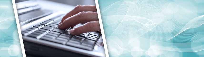 Hands typing on a laptop keyboard. panoramic banner