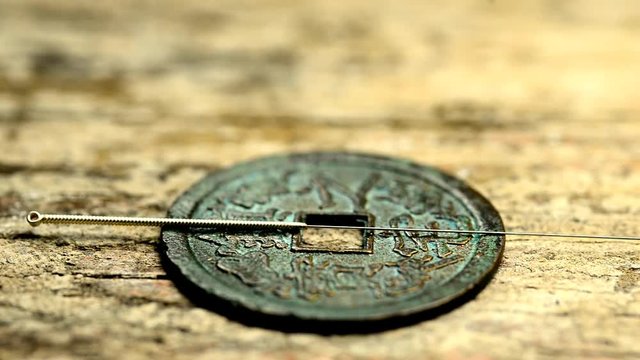 acupuncture needles on antique Chinese coins, camera drive