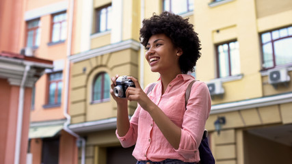 Beautiful lady taking photos, female student travelling on vacation, sightseeing