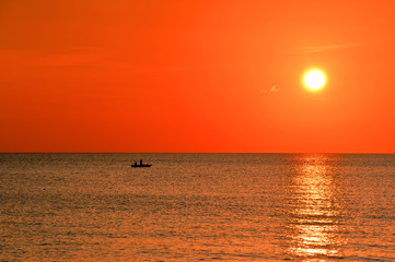 Fishermen at the South China Sea by stunning sunset. Pulau Tioman, Malaysia