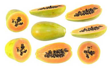 Big set of half cut and whole papaya fruits isolated on white background
