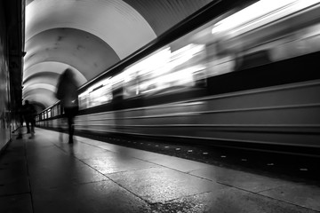 Moving train in the subway. Train silhouette in black and white. Moving train.