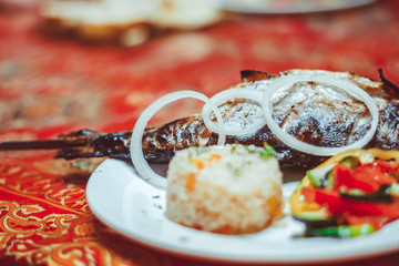 Delicious Asian fish fried on skewers