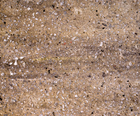 The texture of a stone fence made of granite. Background