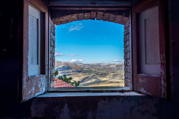 Window View in an Abandoned Ghost Town in Southern Italy