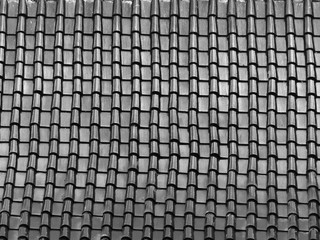 black and white tile roof with light and shadow pattern