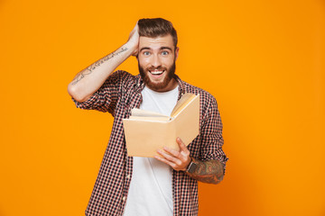 Portrait of an excited young man wearing casual clothes