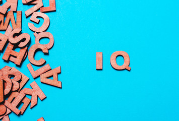 Word  IQ of wooden letters o - obrazy, fototapety, plakaty