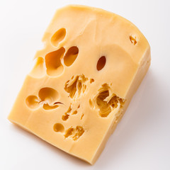 Piece and slices of cheese on a white background