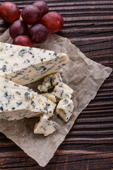 delicious blue cheese on wooden rustic background