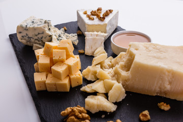 set of different cheeses on a wooden rustic background