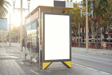 Empty white advertising urban billboard near city bus stop, placeholder template on a street, space...