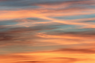 Colorful long clouds in sunset time. Like brush strokes.