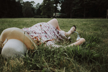 Pregnant woman in dress holds hands on belly. Pregnancy, maternity, preparation and expectation concept. Beautiful tender mood photo of pregnancy.