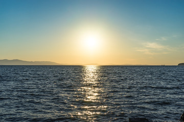Seascape with beautiful sunset and sunset on the horizon.