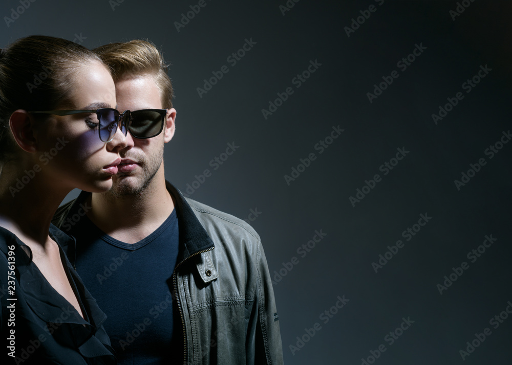 Wall mural trendy eyeglasses. friendship relations. fashion models in sun glasses. couple in love. couple of ma