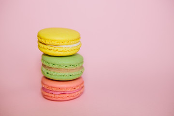 Pink, yellow and green french macaroon with copy space, abstract traffic light