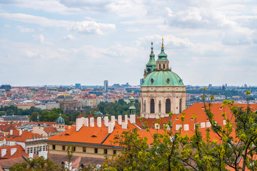 View over historic center of Prague, St. Nicholas Church, red roofs of Prague,  Czech republic