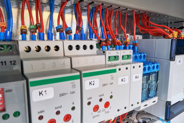 In the electrical Cabinet of the device with adjustment, relay and controller. Wires or cables are...