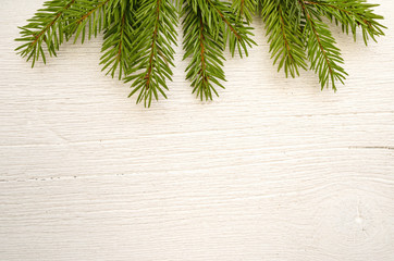 Christmas background with gifts, fir branches on white wooden board