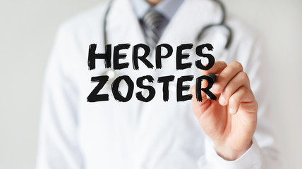 Doctor writing word HERPES ZOSTER with marker, Medical concept - obrazy, fototapety, plakaty