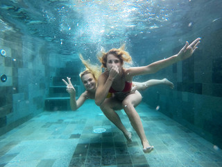 Girls underwater having fun