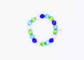 strand of blue green and white multi faceted jewelry beads