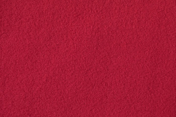 Texture of red fleece, soft napped fabric