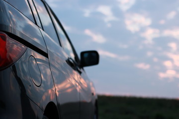 clouds reflecting on car