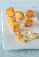 Brie fritters on the white plate
