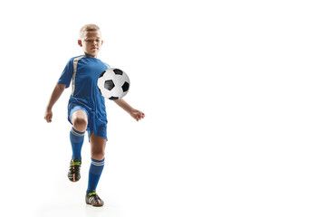 Fototapeta na wymiar Young boy with soccer ball doing flying kick, isolated on white. football soccer players in motion on studio background. Fit jumping boy in action, jump, movement at game.
